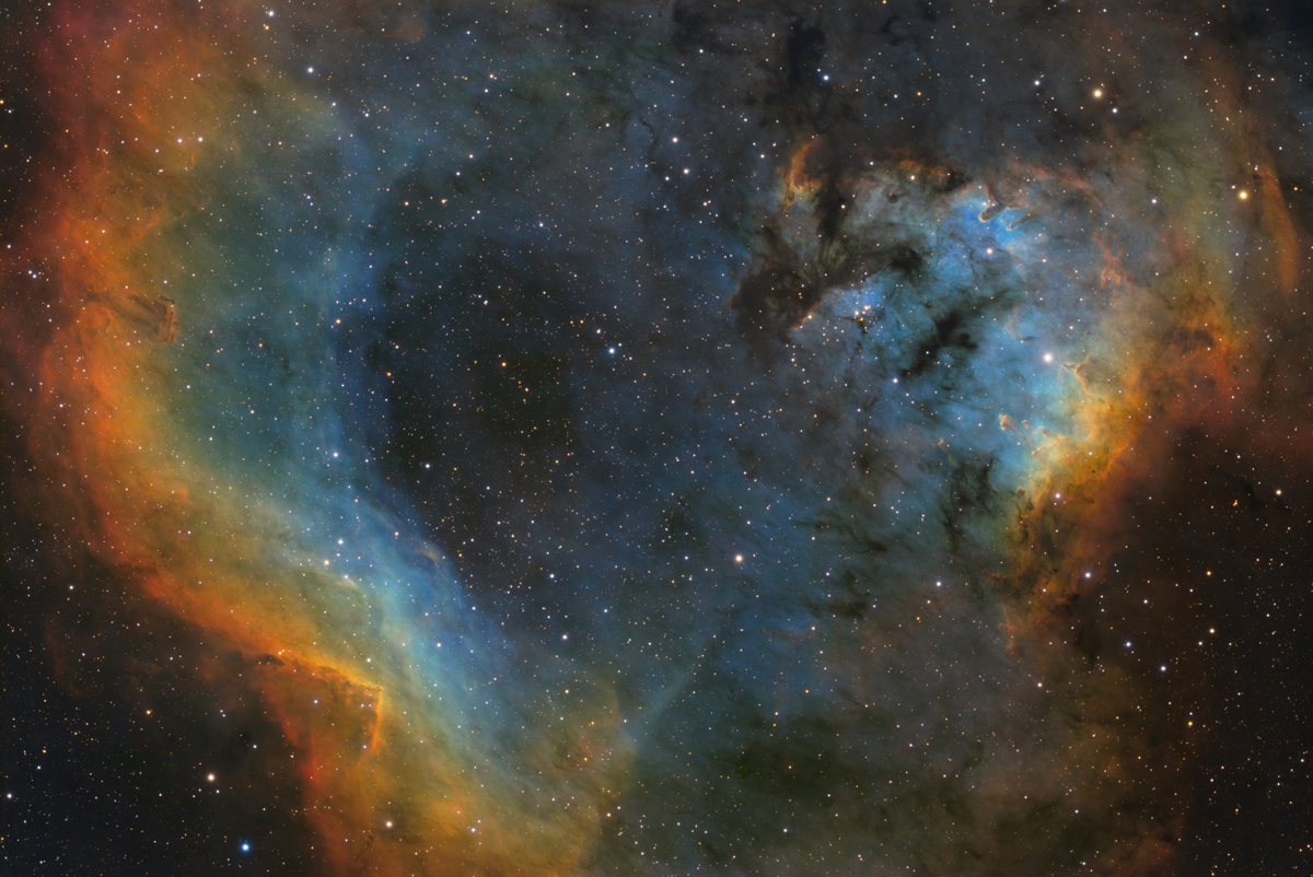 NGC 7822 - The Question Mark Nebula by Charles Hagen. Taken with a QHYCCD QHY268M cooled astronomy camera, a Sky-Watcher Esprit 100ED refractor telescope, and an Astro-Physics 900GTO mount.
