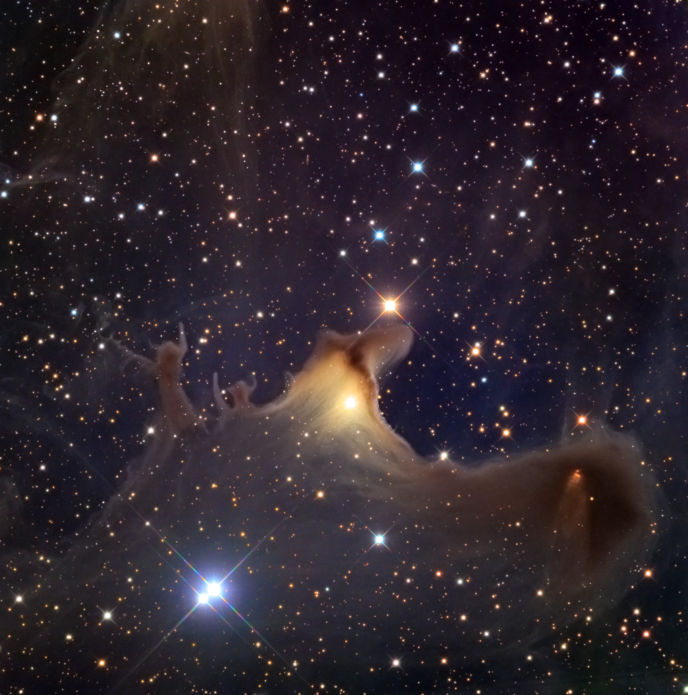 Sh2-136 large dusty area with glowing star lighting it up yellow