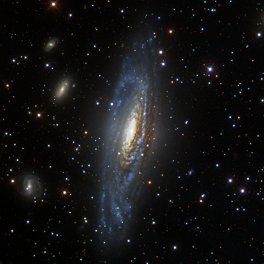 The Deer Lick Group, a collection of bright foreground galaxy NGC 7331 and several smaller, more distant background galaxies, captured by NASA.