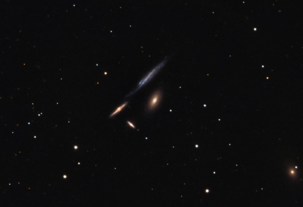 Hickson 61 galaxy group featuring four interacting galaxies, showing faint structures distorted shapes, captured in deep detail by Tony Alexandre Photography.