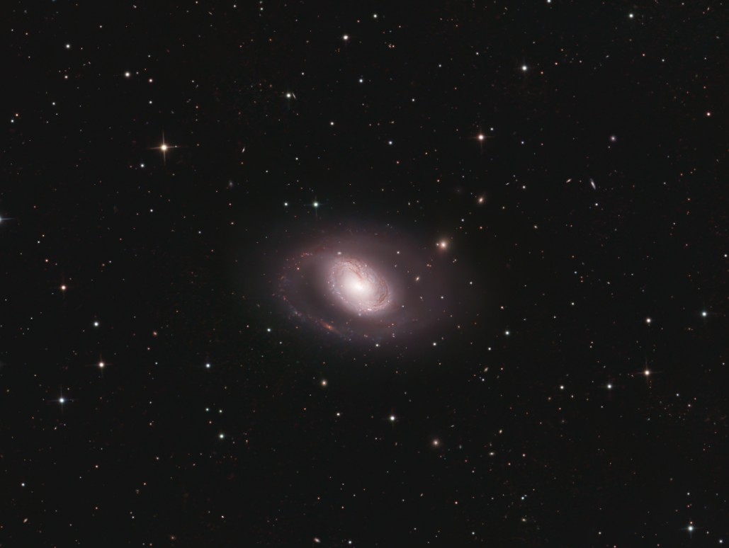 Spiral galaxy M96, showing a bright core with slightly uneven spiral arms and subtle dust lanes, captured in fine detail by astrophotographer Mike Manning.