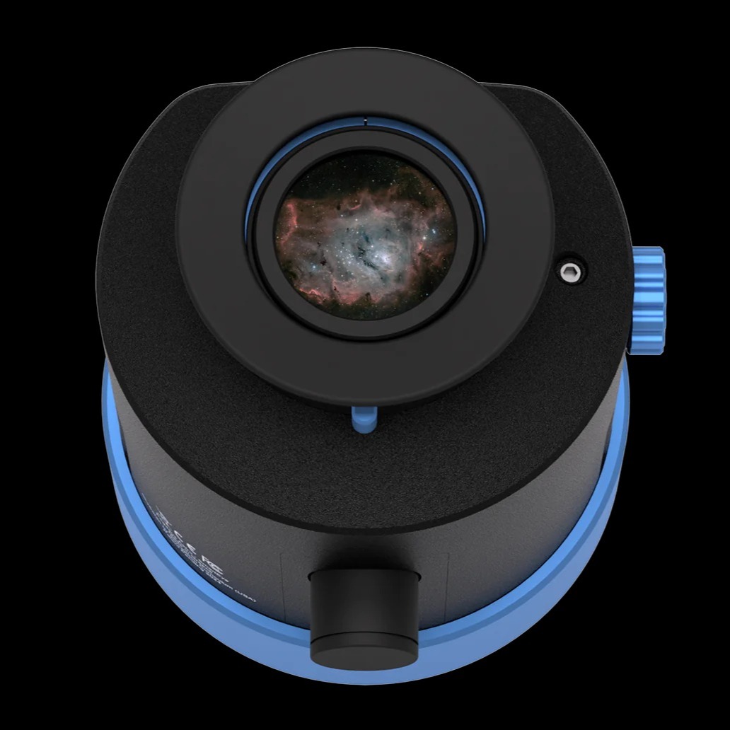 The SmartEye with its front  screen showing, the Lagoon Nebula is reflected in the glass.